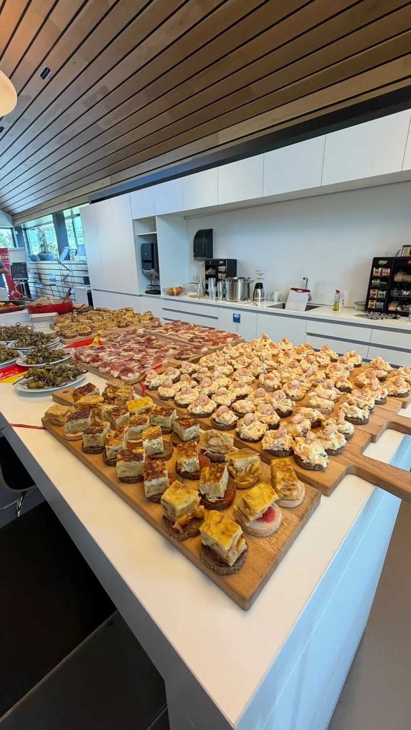 A long catering buffet of small plates
